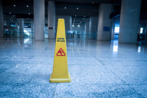 Personal Injury Lawyer Simi Valley, CA - slippery floor sign on white slippery floor
