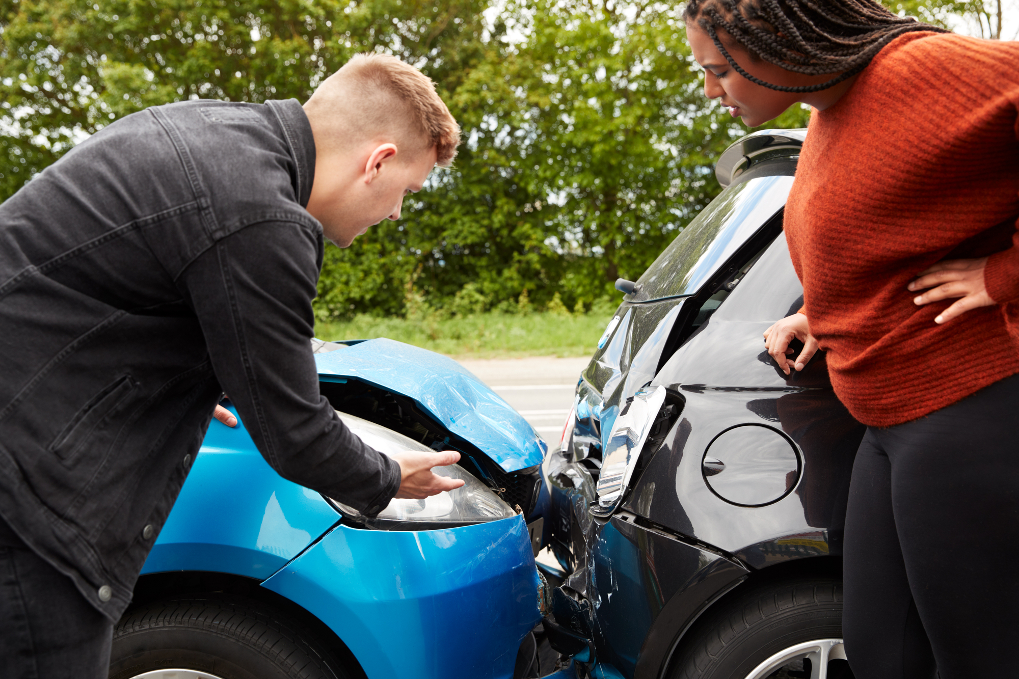 Uninsured Motorist Coverage - Two Angry Motorists Arguing Over Responsibility For Car Accident