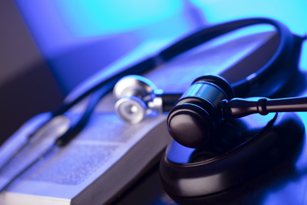 What You Need to Know About Wrongful Death - stethoscope with book
