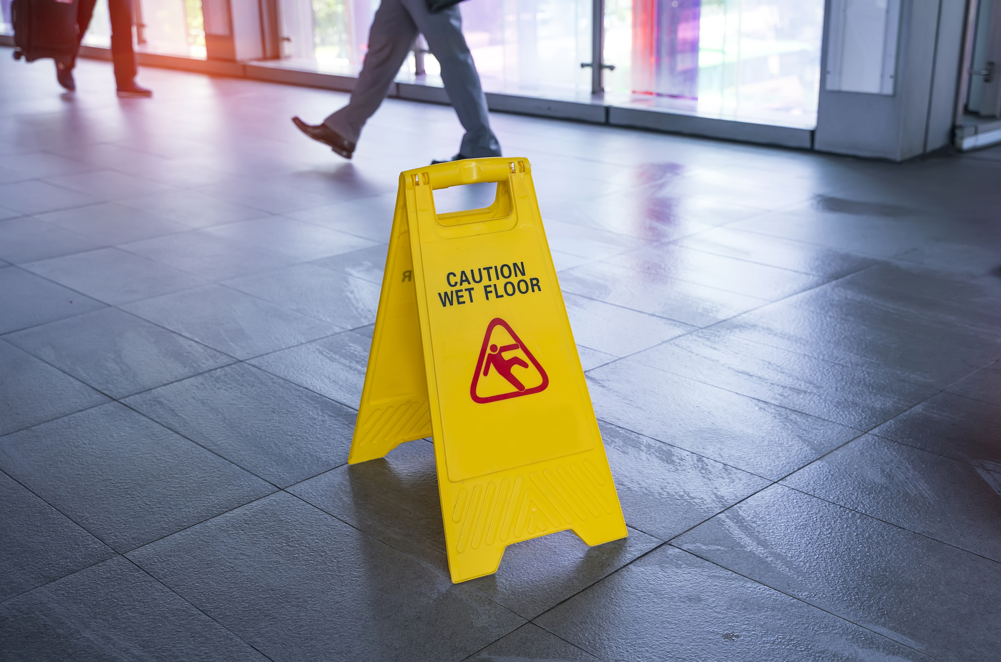 Premises Liability Tips - "Caution wet floor" sign